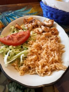 Lunch Camarones Mexicanos with rice, guacamole salad, and tortillas