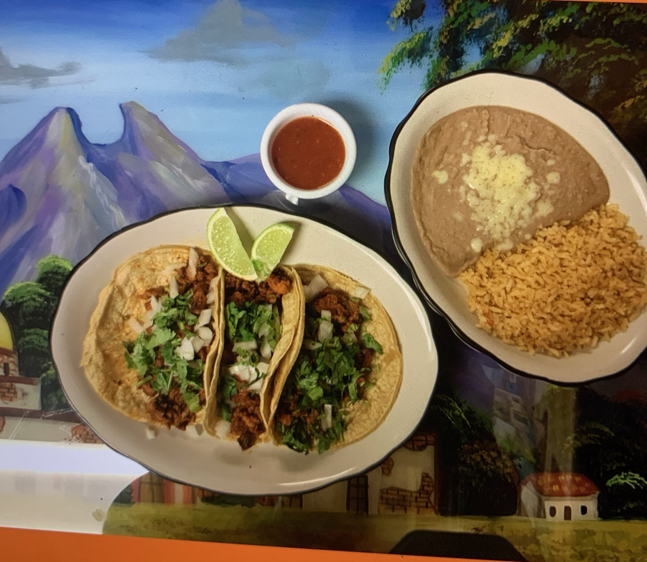 Delicious Tacos Al Pastor with sliced pineapple and cilantro on a corn tortilla served at Rey Azteca Somerset.